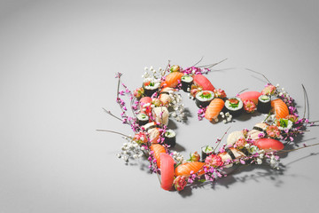Heart made of sushi and flowers. Love sushi. Valentines Day (14 February), Mother's day, Woman's...