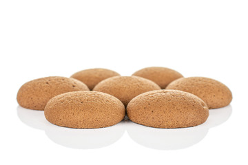 Group of seven whole sweet brown chocolate sponge biscuit isolated on white background