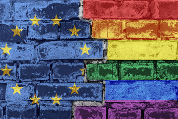 European Union and LGBT flag on a brick wall