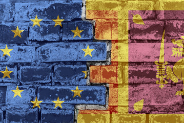 The flag of the European Union and Sri Lanka on a brick wall