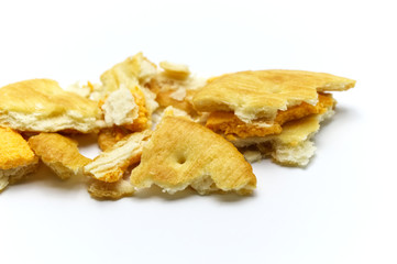 Biscuit and crumbs of sandwich cracker Cheese flavoured ,Cream and butter. Crunchy delicious sweet meal and useful cookies. On white background. Selective focus.