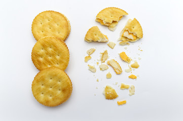Biscuit and crumbs of sandwich cracker Cheese flavoured ,Cream and butter. Crunchy delicious sweet meal and useful cookies. On white background.