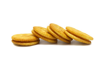 Biscuit sandwich cracker Cheese flavoured ,Cream and butter. Stack of crunchy delicious sweet meal and useful cookies. Isolated on white background.