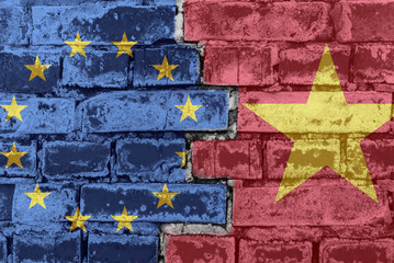European Union and Vietnam flag on a brick wall