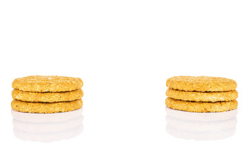 Group of six whole sweet golden oat cookie isolated on white background