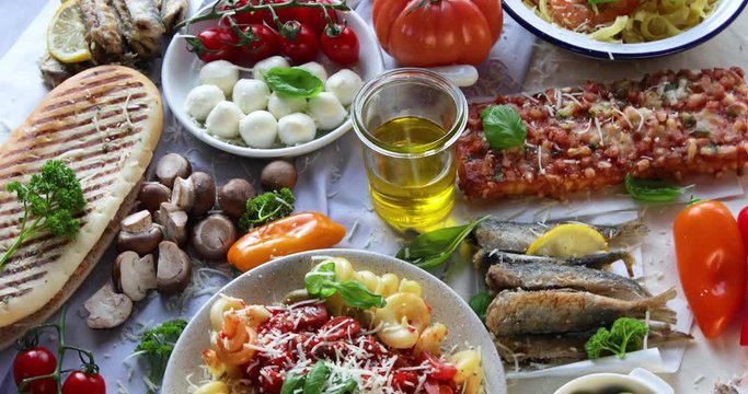 Traditional Italian foods  with pizza, pasta, olives, vegetables. Healthy mediterranean diet. Top view