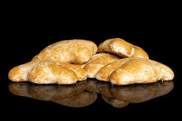 Lot of whole sweet brown gingerbread isolated on black glass