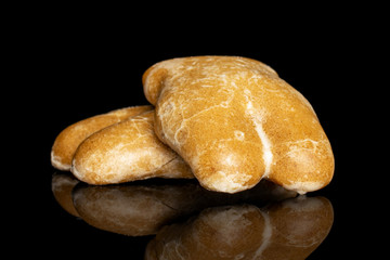 Group of two whole sweet brown gingerbread isolated on black glass
