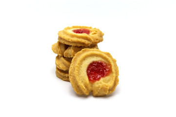 Butter cookies strawberry jam topping and sweet flavored and pile of biscuits cracker homemade on white background.