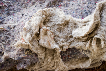 Old burlap and batting. Protruding threads. Conceptual background for design.