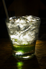 glass of mojito with ice on black background