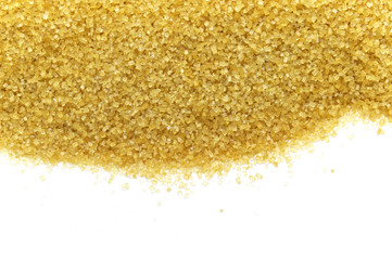 Brown sugar isolated on white background. Top view and copy space.