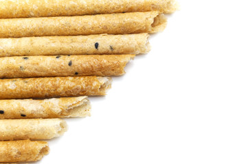 Tong Muan (crispy egg roll mix with sesame), Thai dessert Roll wafer, A traditional dessert in Thailand   isolated on white background and copy space.