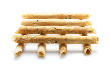 Tong Muan (crispy egg roll mix with sesame), Thai dessert Roll wafer, A traditional dessert in Thailand   isolated on white background.