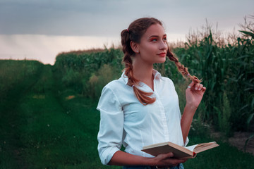  Young girl in a corn field.