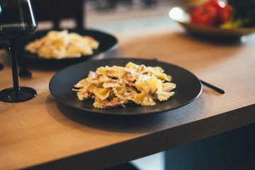Fresh hot home made pasta on kitchen table.