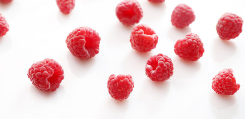 Red ripe raspberries on white background. Top vew