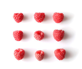 Set of red raspberries isolated on white background