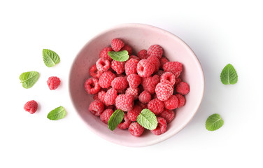 Bowl of red raspberries isoalted on white background