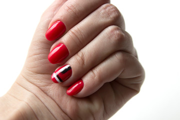 fresh modern manicure, red nails, one of the nails has an abstract drawing.
