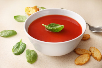 Bowl of tomato soup on kitchen table