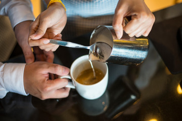 Fototapeta na wymiar man pouring coffee in cup