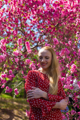 Blonde model in sakura garden 