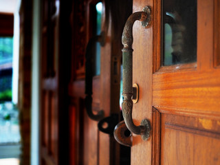 old Door handle close up of wood door