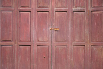 Old wooden vintage door painted in brown