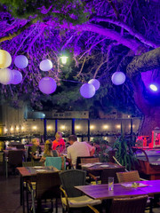 Family at street cafe with lantern illuminated at night Dubrovnik