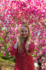 Obraz na płótnie Canvas Blonde model in sakura garden 