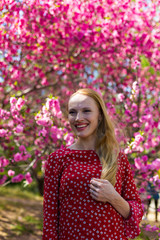 Blonde model in sakura garden 