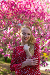 Blonde model in sakura garden 