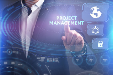 Business, Technology, Internet and network concept. Young businessman working on a virtual screen of the future and sees the inscription: Project management