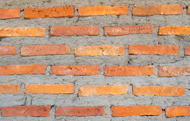Obraz premium A orange brick wall background, wallpaper