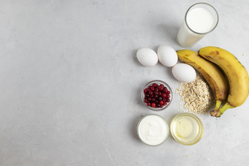 Pancakes with oatmeal and greek background on a light background