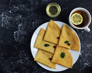 pancakes with cranberries on a black background, berry pancakes, pancakes without flour
