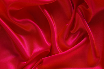 Red cloth waves background texture.