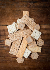 Fototapeta premium Abstract assortment of edible crackers in a a variety of shapes and textures as a flat lay