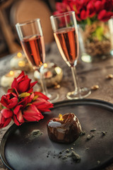 valentines day, heart cake on dark plate, romantic evening with flowers and gift