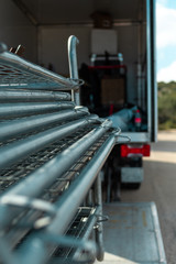 detail of a truck discharging fences and other materials for work
