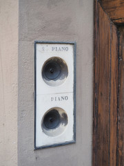 Two old house bells, names are not engraved on the marble but only first and second floors.