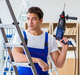 Repairman working with drilling drill perforator