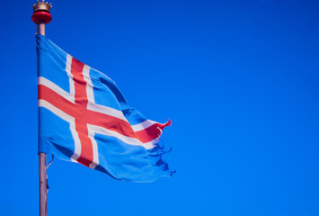 Icelandic flag against blue sky