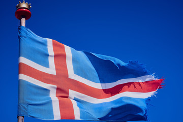 Icelandic flag against blue sky