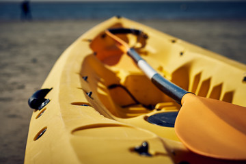 yellow kayak on the seashore