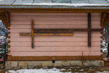 Wooden crosses hang on the wall of an old wooden church in the Carpathian village of Yaremche....