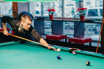 A man tries his hand at playing billiards. He is accompanied by various emotions, satisfaction,...