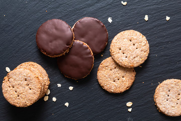 Healthy food concept fresh baked Homemade organic digestive Oat and wheat Bran chocolate dipped Cookies with copy space