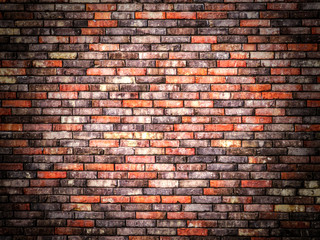 Fototapeta na wymiar Colorful old brick wall background with dark vignette